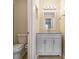 Bathroom featuring a white vanity with a mirror and light fixture at 257 Country Club Dr, Jonesboro, GA 30238