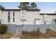 Townhome exterior with gray siding and private entrance at 257 Country Club Dr, Jonesboro, GA 30238