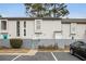 Two-story townhome with gray siding and fenced backyard at 257 Country Club Dr, Jonesboro, GA 30238