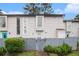 View of townhome with a tidy lawn and tall windows at 257 Country Club Dr, Jonesboro, GA 30238