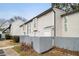 Side view of townhome, showing gray siding and fence at 257 Country Club Dr, Jonesboro, GA 30238