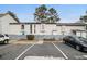 Front view of townhome with parking and landscaping at 257 Country Club Dr, Jonesboro, GA 30238