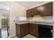 Kitchen with granite countertops and dark wood cabinets at 257 Country Club Dr, Jonesboro, GA 30238