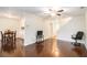 Cozy living area offering hardwood floors, ceiling fan, and a view of the dining area at 257 Country Club Dr, Jonesboro, GA 30238