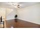 Open-concept living room featuring hardwood floors, ceiling fan, and natural light at 257 Country Club Dr, Jonesboro, GA 30238
