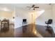 Living room with dark floors, dining area view, and stairs at 257 Country Club Dr, Jonesboro, GA 30238