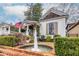 Charming white house with a wrap-around porch and fountain at 296 Logan Se St, Atlanta, GA 30312