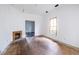 Living room with hardwood floors, fireplace, and large window at 296 Logan Se St, Atlanta, GA 30312