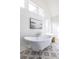 Bathroom with freestanding bathtub and patterned floor tile at 359 Woodward Se Ave, Atlanta, GA 30312