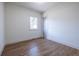 Simple bedroom with hardwood floors and a window at 359 Woodward Se Ave, Atlanta, GA 30312