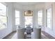 Sunlit dining room with stained glass windows and modern dining set at 359 Woodward Se Ave, Atlanta, GA 30312