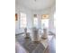 Bright dining room features stained glass windows and a glass-top dining table at 359 Woodward Se Ave, Atlanta, GA 30312