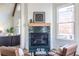 Modern fireplace with green tile surround and hardwood floors at 359 Woodward Se Ave, Atlanta, GA 30312