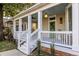 Charming front porch with white railings and steps at 359 Woodward Se Ave, Atlanta, GA 30312