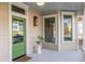 Inviting front porch with green door and potted plant at 359 Woodward Se Ave, Atlanta, GA 30312