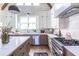 Modern kitchen featuring white cabinets, quartz countertops, and wood flooring at 359 Woodward Se Ave, Atlanta, GA 30312