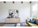 Living area with light walls, wood floors, and mid-century modern furniture at 359 Woodward Se Ave, Atlanta, GA 30312