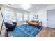 Bright sitting area with blue patterned rug and large windows at 359 Woodward Se Ave, Atlanta, GA 30312