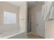 Bathroom featuring a soaking tub, walk-in shower, and natural light at 498 Anglewood Trce, Stockbridge, GA 30281