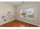 Bedroom with hardwood floors and jungle-themed wall art at 498 Anglewood Trce, Stockbridge, GA 30281