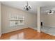 Open-concept living area with hardwood floors and natural light from the window at 498 Anglewood Trce, Stockbridge, GA 30281