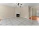 Living room with fireplace, tile flooring, and ample natural light at 498 Anglewood Trce, Stockbridge, GA 30281