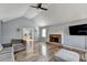 Open living room with hardwood floors, fireplace, and view into dining area at 13 Maplewood Ct, Acworth, GA 30101