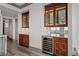 Built in bar with hardwood cabinets and a wine fridge at 3630 Peachtree Ne Rd # 2207, Atlanta, GA 30326