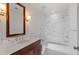 Elegant bathroom featuring marble countertops, modern fixtures, and a sleek shower-tub combination with marble tile at 3630 Peachtree Ne Rd # 2207, Atlanta, GA 30326