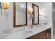 Beautiful bathroom featuring double sinks, a vanity with wood cabinets, and stylish lighting fixtures at 3630 Peachtree Ne Rd # 2207, Atlanta, GA 30326