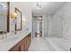 Elegant bathroom with double vanity, marble counters, soaking tub and glass-enclosed shower at 3630 Peachtree Ne Rd # 2207, Atlanta, GA 30326