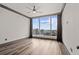 Bright bedroom features hardwood floors, a ceiling fan, large windows and fantastic city views at 3630 Peachtree Ne Rd # 2207, Atlanta, GA 30326