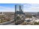 An aerial view of the luxury high rise, with a mirrored facade and surrounded by city views at 3630 Peachtree Ne Rd # 2207, Atlanta, GA 30326