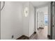 Hallway featuring hardwood floors, unique lighting, and neutral wall colors at 3630 Peachtree Ne Rd # 2207, Atlanta, GA 30326