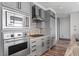 Modern kitchen featuring a gas range, built in microwave and oven, and stainless steel appliances at 3630 Peachtree Ne Rd # 2207, Atlanta, GA 30326
