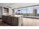 Open kitchen featuring a large island, modern lighting, and panoramic city views at 3630 Peachtree Ne Rd # 2207, Atlanta, GA 30326
