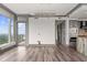 View of the open kitchen from a bright living area with big windows at 3630 Peachtree Ne Rd # 2207, Atlanta, GA 30326