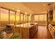 Modern kitchen features a marble island, stainless steel appliances, and a stunning city view at sunset at 3630 Peachtree Ne Rd # 2207, Atlanta, GA 30326