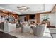 Elegant living room with fireplace, built-in bookshelves, a custom ceiling light, and comfortable seating at 3630 Peachtree Ne Rd # 2207, Atlanta, GA 30326