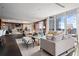 Expansive living room with city views, custom lighting, and hardwood floors. Modern luxury and elegance combined at 3630 Peachtree Ne Rd # 2207, Atlanta, GA 30326