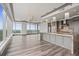 Spacious living room with floor-to-ceiling windows and city views leads into an open kitchen at 3630 Peachtree Ne Rd # 2207, Atlanta, GA 30326