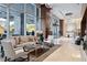 Grand lobby with elegant seating, a modern chandelier, high ceilings, and large windows with natural light at 3630 Peachtree Ne Rd # 2207, Atlanta, GA 30326
