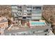 Aerial view of rooftop oasis with pool, hot tub, fireplace, and lounge areas, perfect for relaxation and entertainment at 3630 Peachtree Ne Rd # 2207, Atlanta, GA 30326