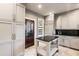 Well-lit kitchen featuring modern appliances, an island and lots of storage at 1125 Lake Shore Overlook, Alpharetta, GA 30005