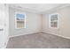 Bright bedroom with two windows, neutral walls, and plush carpeting at 3300 Russell St, Atlanta, GA 30354