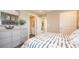 Bedroom featuring a dresser, natural light, a bed, and access to the bathroom at 146 Oakchase Park Ln, Hampton, GA 30228