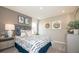 Neutral bedroom with a full size bed, natural light and matching furniture at 146 Oakchase Park Ln, Hampton, GA 30228