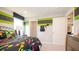 Vibrant bedroom with themed decorations, a cozy bed, and ample space, creating a fun and inviting atmosphere at 146 Oakchase Park Ln, Hampton, GA 30228