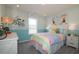 Charming bedroom with a colorful striped comforter and bicycle themed decor at 146 Oakchase Park Ln, Hampton, GA 30228