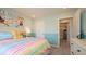 Cozy bedroom with a pastel color scheme and bike themed decorations at 146 Oakchase Park Ln, Hampton, GA 30228